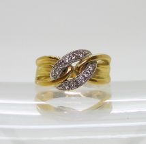 A DIAMOND RING made in Italy from 18ct yellow and white gold with a chain link design, the white