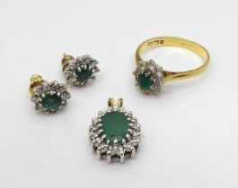 AN EMERALD & DIAMOND SUITE comprising of a 18ct gold ring, size P1/2, set with a central emerald