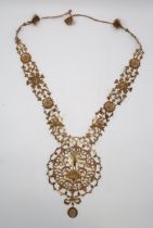 MOGHUL GILT WIRE EMBROIDERED NECKLETS woven with flowerheads, birds and one with a coat of arms,