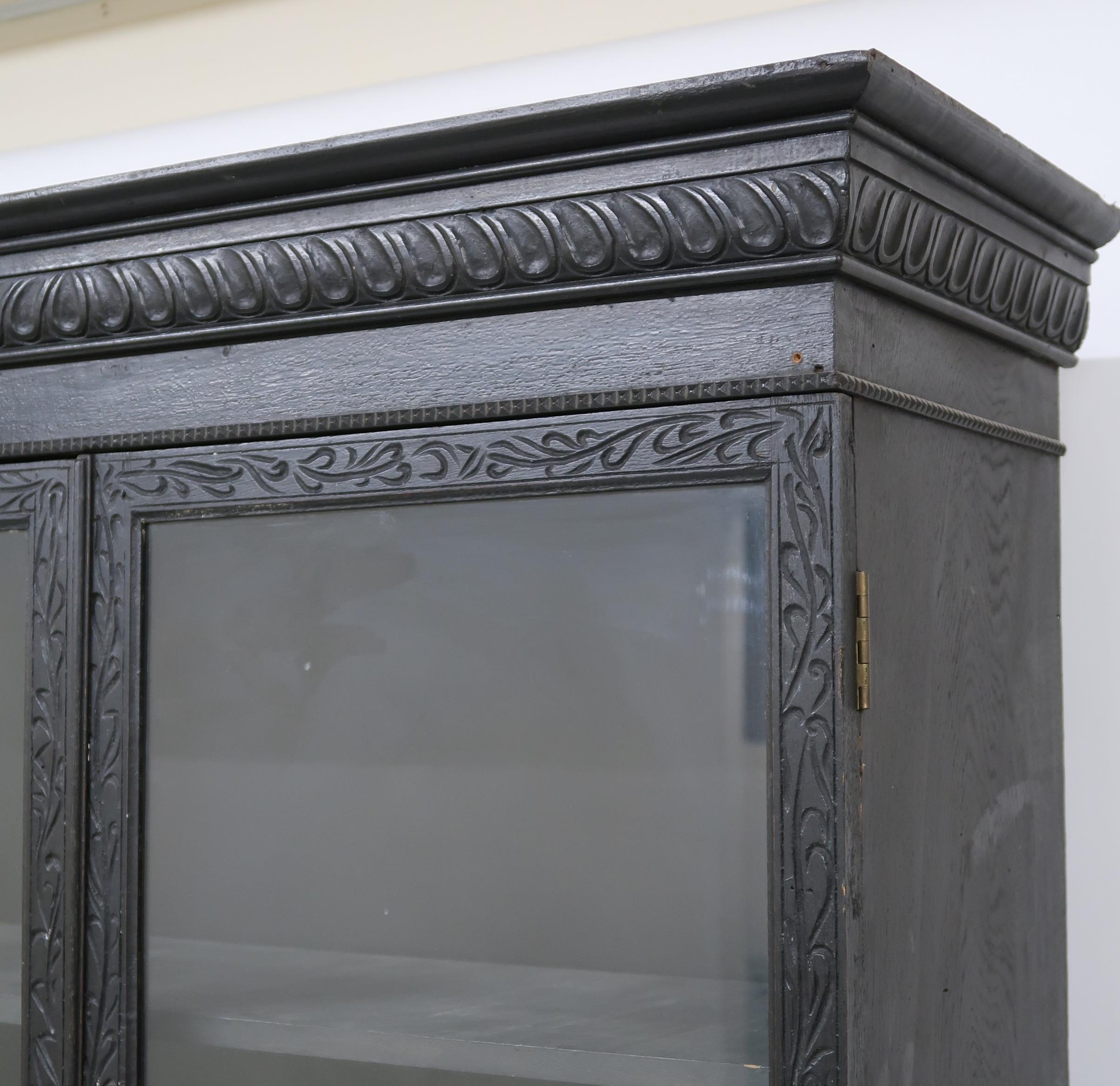 A PAIR OF 20TH CENTURY EBONISED GLAZED BOOKCASES  with gadrooned moulded cornices over pairs of - Image 3 of 12