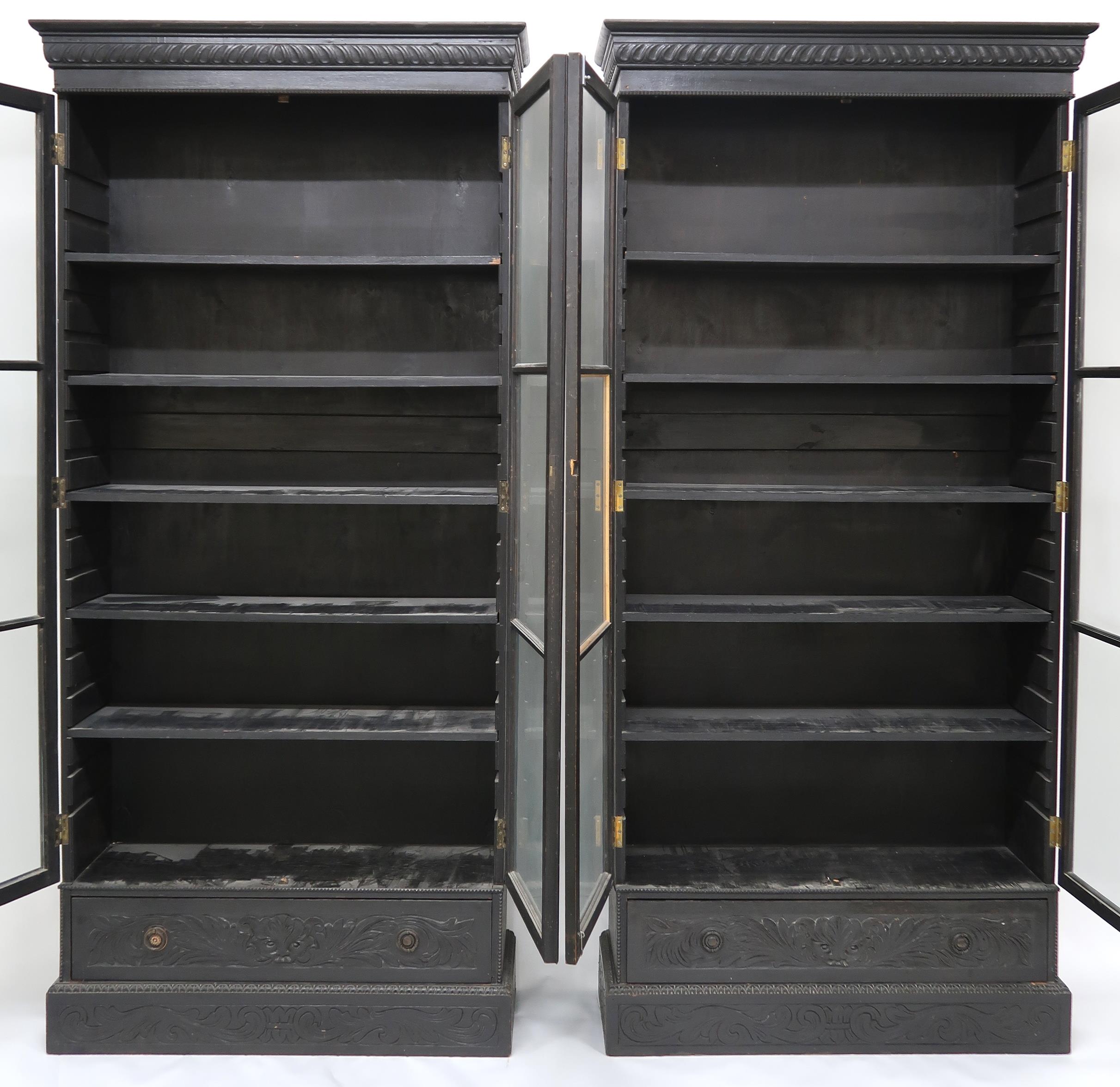 A PAIR OF 20TH CENTURY EBONISED GLAZED BOOKCASES  with gadrooned moulded cornices over pairs of - Image 12 of 12