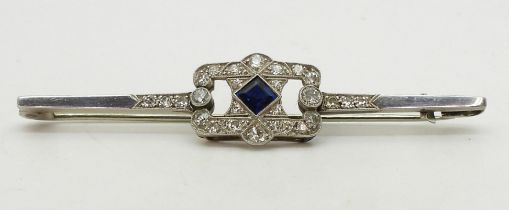 A SAPPHIRE & DIAMOND BROOCH set with a square cut sapphire and brilliant and eight cut diamonds with