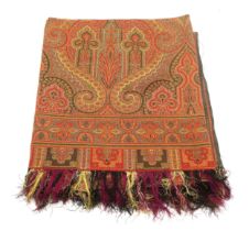 A VICTORIAN PAISLEY SHAWL Woven in hues of red and gold, measuring approx. 172cm x 165cm Condition