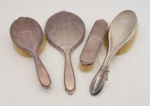 A three piece silver dressing set, by Adie Brothers ltd, Birmingham 1957, and another silver hair