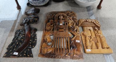 Four carved Ghanaian carved wooden panels Condition Report:No condition report available.