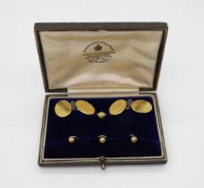 A pair of 18ct gold cufflinks with monogram and date (1922) and four studs, weight together 17.