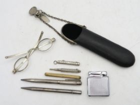 A small selection of propelling pencils, to include two London silver examples, small folding button