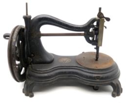 A Victorian Serpentine, Swan Neck or Cat Back hand-crank sewing machine by Jones & Co. of Manchester