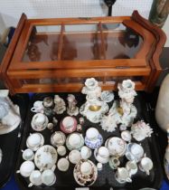 A collection of miniature cups and saucers, Dresden style figures etc and a display case Condition