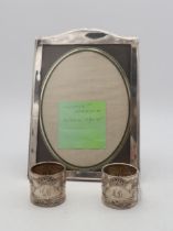 A George V silver photo frame, by Henry Matthews, Birmingham 1915, and two continental white metal
