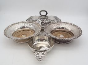 A collection of EPNS including a tureen, stand and strainer, decorated with scrolling shell