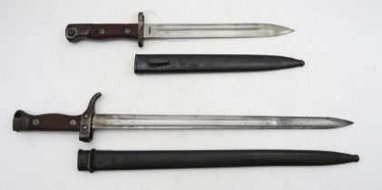 A Siamese M1935 Mauser bayonet, the blade measuring approx. 25cm in length and housed in a steel