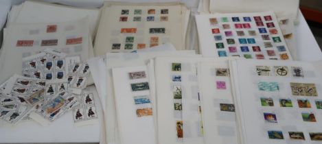 A large world collection on mainly loose pages, many thousands of stamps including United States