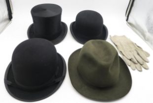 A selection of gentleman's hats, comprising a boxed silk top hat by Moss Bros., two bowlers (one
