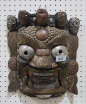 A  tribal mask with metal decoration and a carved stick of snakeshead form Condition Report:No