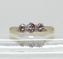 An 18ct three stone diamond ring, set with estimated approx 0.25cts of brilliant cut diamonds finger