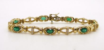 A 14k gold emerald and diamond bracelet, set with estimated approx 0.20ct of brilliant cut