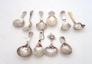 A collection of Georgian and later silver caddy spoons, one possibly by Elizabeth Morley, London