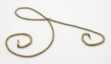 A yellow metal fancy link necklace made from a guard chain, length 58cm, weight 8.1gms Condition