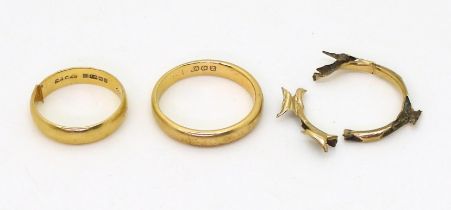 Two 18ct gold wedding rings, sizes Q, and J (shank cut) and a yellow metal ring (elephant hair