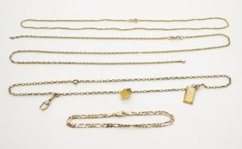A 9ct chain hung with three pendants, a gem set wishbone, dice and ingot, together with a 9ct figaro