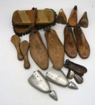 A collection of wooden shoe lasts and a shoe shine kit with assorted brushes Condition Report: