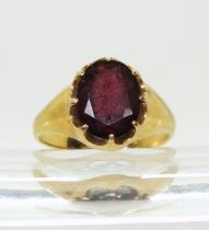 A bright yellow metal garnet ring, size N1/2, weight 5.4gms Condition Report:Available upon request