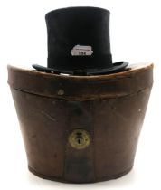 A silk top hat by Tress & Co., London, of medium size, measuring internally approx. 20cm front-to-