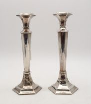 A pair of silver candlesticks, by William Adams, Birmingham, of tapering cylindrical form, on