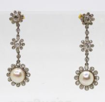 A pair of 9ct gold and white metal pearl & diamond daisy flower earrings, length of the drop 3.