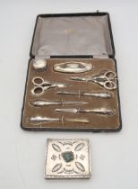 A cased silver stainless steel manicure set, by Samuel M Levi, Birmingham, and a Navajo white