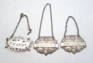 A matched pair of silver decanter labels, 'Dry Sherry' and 'Madeira', by Turner & Simpson,