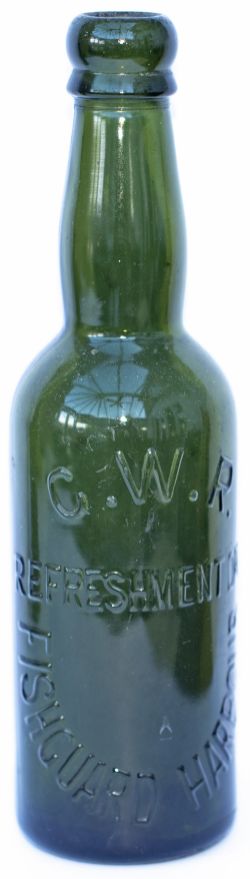 GWR REFRESHMENT DEPARTMENT FISHGUARD HARBOUR green glass Beer Bottle. Stands 9in tall and is in