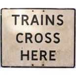 Road sign TRAINS CROSS HERE. Rectangular cast aluminium in original condition complete with both