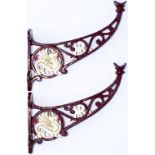 Midland Railway cast iron luggage rack supports, a pair, with MR and the Wyvern cast into them.