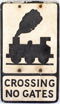Road sign CROSSING NO GATES depicting an 0-6-0 locomotive. Rectangular cast aluminium in original