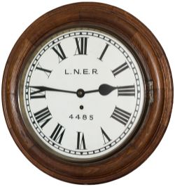 North Eastern Railway 12in dial oak cased railway clock with a spun brass bezel and a chain driven