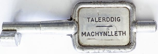 GWR/BR-W Tyers No9 single line aluminium key token TALERDIGG - MACHYNLLETH, configuration B. In ex