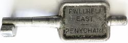 BR-W Tyers No9 single line aluminium key token PWLLHELI EAST - PENYCHAIN, configuration C. In ex