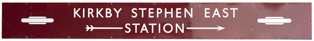 BR(M) enamel station direction sign KIRKBY STEPHEN EAST with two totems and right facing arrow. From