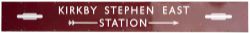 BR(M) enamel station direction sign KIRKBY STEPHEN EAST with two totems and right facing arrow. From
