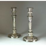 A pair of George III silver mounted candlesticks