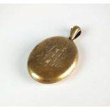 A Victorian yellow metal locket