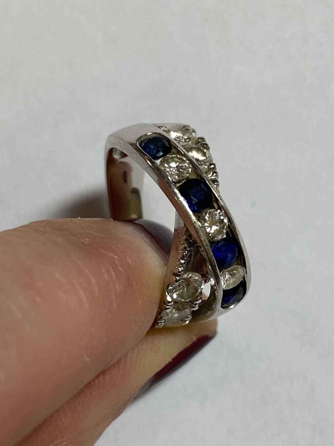 A diamond and sapphire crossover ring - Image 8 of 10