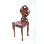 A Black Forest inlaid walnut musical chair