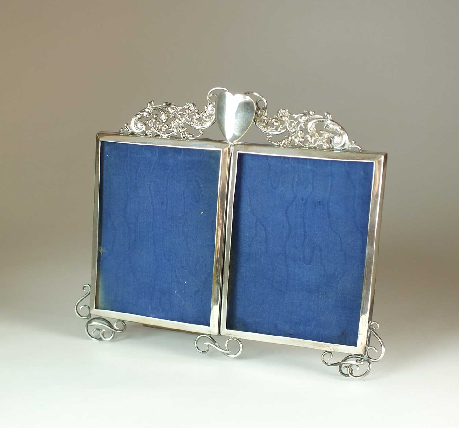 A silver plated double photograph frame