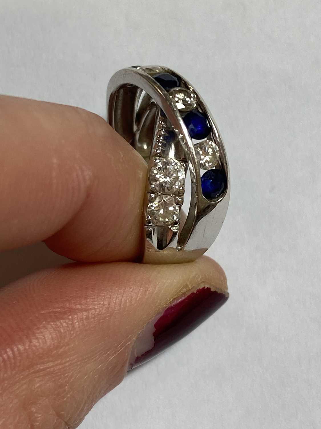 A diamond and sapphire crossover ring - Image 2 of 10