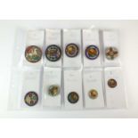 A collection of ten silver and polychrome enamel coins
