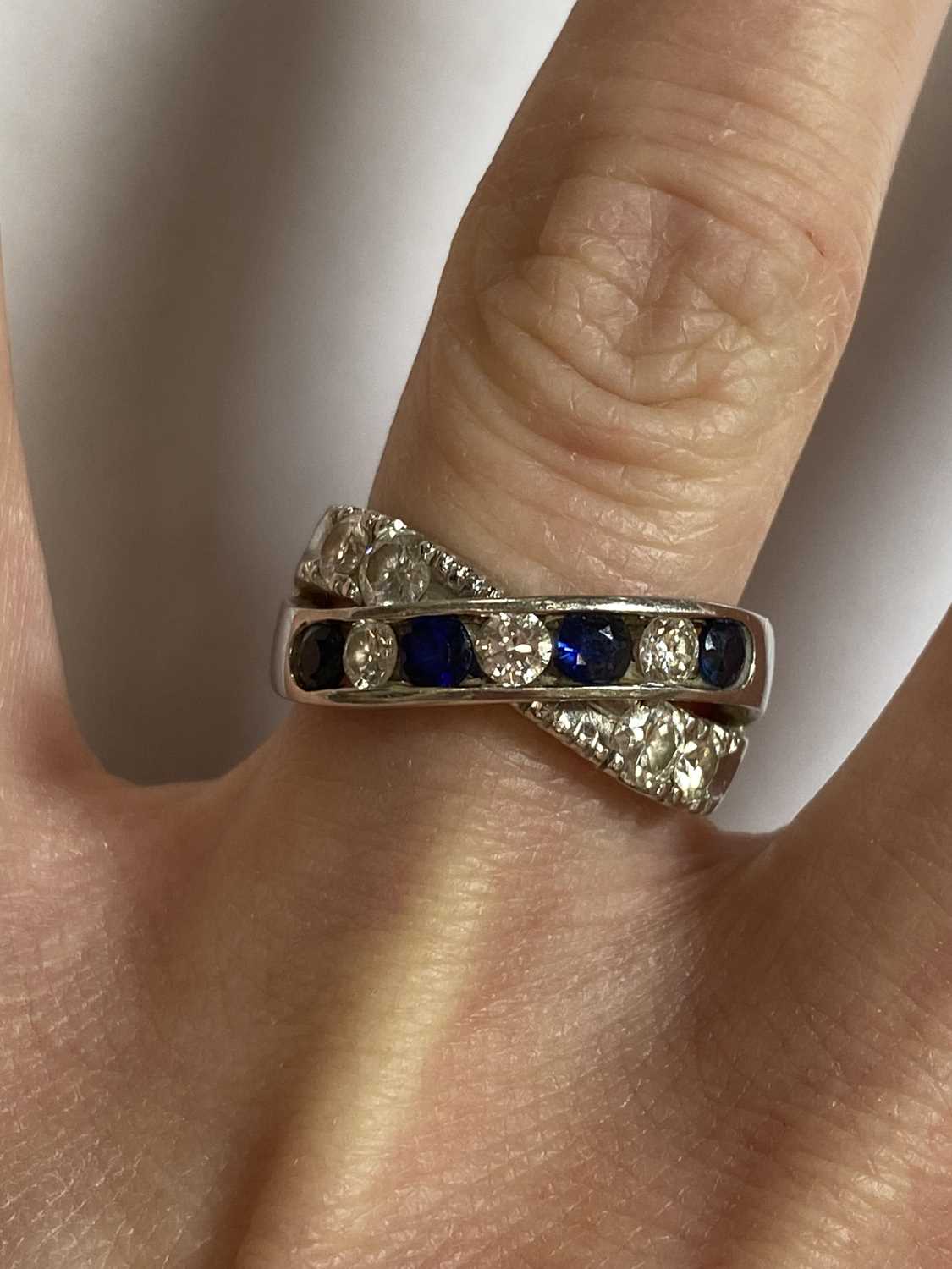 A diamond and sapphire crossover ring - Image 4 of 10