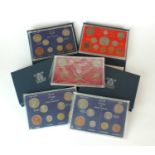 Seven Elizabeth II coin sets